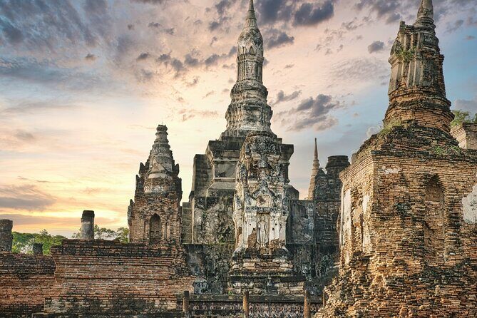 Ayutthaya Famous Temple & Scenic Boat Tour From Train Station - Wat Yai Chai Mongkhon: towering chedi and rows of Buddha images