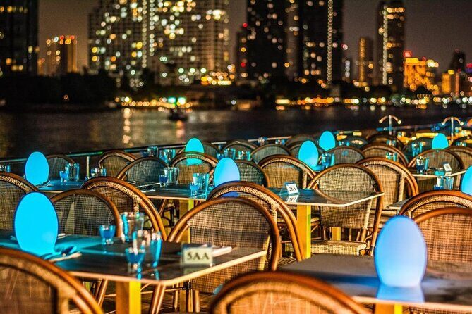 Bangkok Sunset or Evening Dinner Cruise (The Planet Cruise) - Chao Phraya at night: skyline colors, bridges, and palace-area views