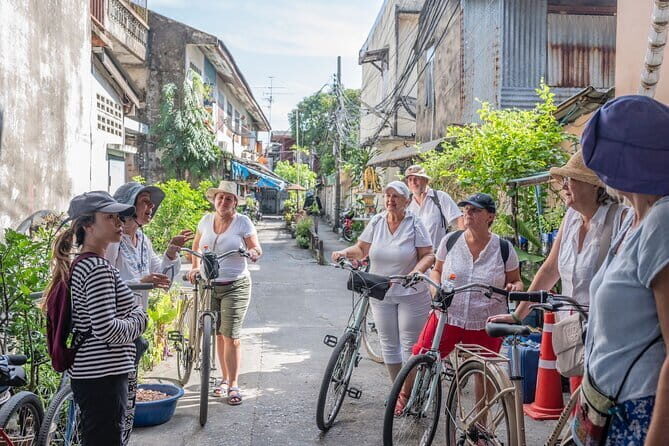 Bangkok Thonburi Backstreets and 3 Peaceful Temple Bike Tour - Wat Khun Chan: colorful statues, a massive seated Buddha, and mythical creatures