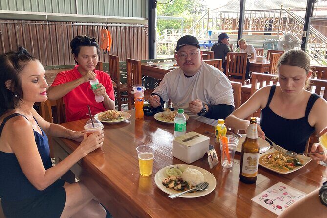 Damnoen Saduak and Maeklong Railway Market Tour with Private Car - Damnoen Saduak by paddle boat: canal life at a slower speed