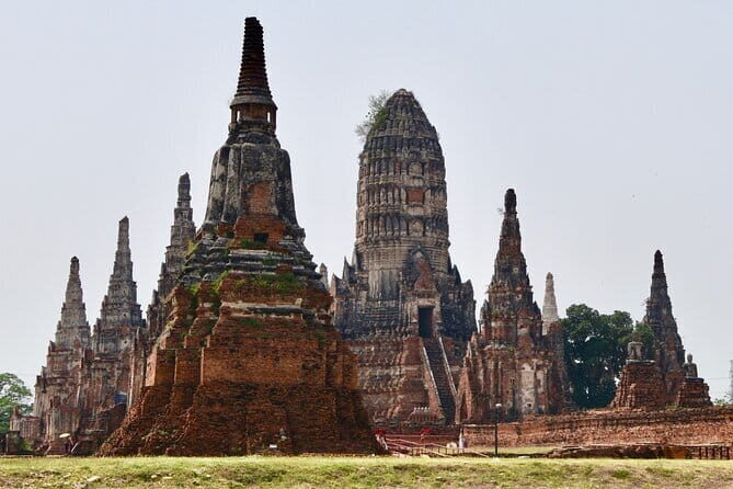 From Bangkok: Ayutthaya UNESCO Heritage Park and Temples Tour - Wat Mahathat’s tree-root Buddha head: the most iconic stop, explained