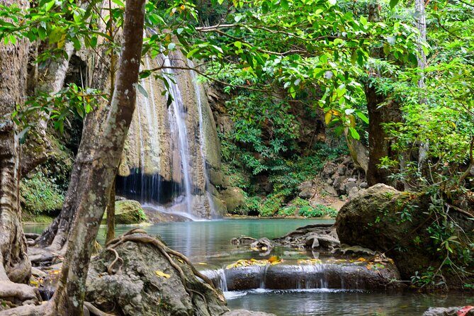 Private 2 Day Tour to Erawan Waterfall and Highlights of Kanchanaburi - Mae Klong Railway Market: the track runs through the market