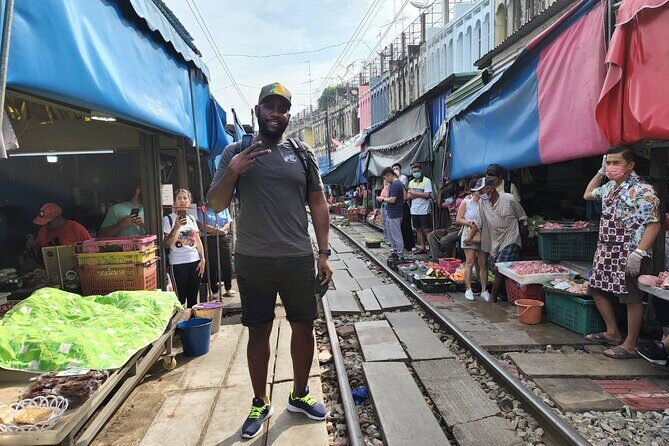 Private Floating Market and Maeklong Railway Market Day Tour - Maeklong Railway Market: shopping with a train line inside it