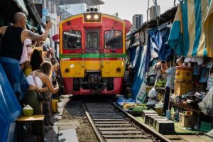 Private Tour to Maeklong Railway Market and Floating Market - Damnoen Saduak Floating Market by boat: Thai sweet treats and canal photos