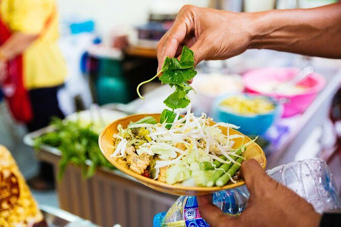 The 10 Tastings of Bangkok: Private Street Food Tour - Or Tor Kor (OTK) Market: fruit season, satay with peanut sauce, and market theater