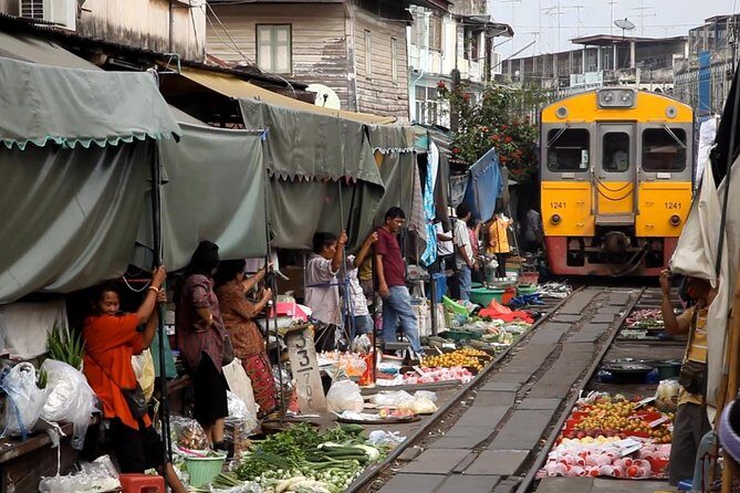 Unique Bangkok Markets: Train Market & Floating Market Adventure - Mae Klong Railway Market: The Umbrella Pulldown Moment on Real Tracks